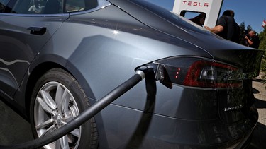 An image of a Tesla Model S topping up at a Supercharger