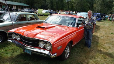 Bill Blackall with the Competition Orange 1968 Mercury Cyclone GT that he bought new when he was a young realtor.