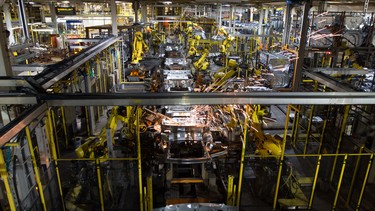 The robots do their work on the line in the Ford Oakville assembly plant, on June 7, 2013. Workers and robotics work together in the million square feet facility to produce over 200,00 cars a year.