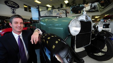 Kelly O'Connell with a 1928 Model A Ford at the Heartland Ford dealership in Fort Saskatchewan.