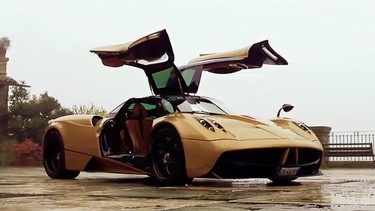 Now that's just showing off: The Pagani Huayra demonstrates its gullwing doors.