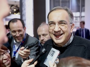 Sergio Marchionne, chief executive officer of Fiat SpA, reacts as he speaks to members of the media following a meeting of motor manufacturers at the Fiat SpA stand, on the second day of the Paris Motor Show in Paris, France, on Friday, Sept. 28, 2012.