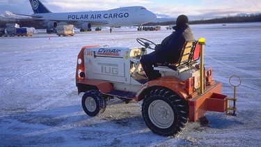 In the midst of a world record attempt in a Vauxhall Frontera, after freighting the vehicle from New Zealand, Garry watched dozens of cargo pallets come off the aircraft in Anchorage, Alaska but no Frontera was delivered.