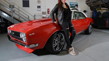 Nicole Rodriguez with her 1969 Camaro SS that she restored with the help of her brother and dad.
