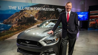 Ford CEO Alan Mulally poses next to the 2015 Ford Mustang on December 5, 2013 in New York City. The 2015 model marks the 50th anniversary of the Ford Mustang line.