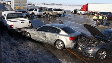 In this file photo, damaged vehicles litter the road after a 40-vehicle pileup in Meridian, Idaho, Jan. 9, 2014. After a collision, it's crucial to know just how much downtime your car will face.