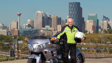 Glenn Turple stands next to his 2009 custom Honda. Turple has logged 1,000,000 miles on motorcycles and was photographed during a stop in Calgary while heading south towards Fernie.