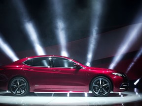 The new Acura TLX Prototype vehicle is revealed at the press preview of the 2014 North American International Auto Show January 14, 2014 in Detroit, Michigan.