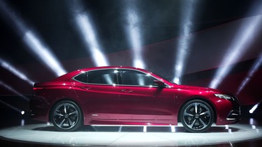 The new Acura TLX Prototype vehicle is revealed at the press preview of the 2014 North American International Auto Show January 14, 2014 in Detroit, Michigan.