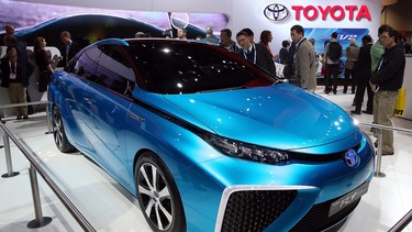 Attendees look at the Toyota FCV fuel cell vehicle concept car at the Toyota booth at the 2014 Consumer Electronics Show at the Las Vegas Convention Center on Jan. 7, 2014 in Las Vegas, Nevada.