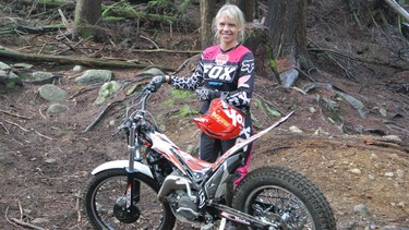 Alexandra Straub takes the 2014 Beta Evo 200 trials bike for a spin in the forest.