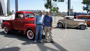 Long time hot rod friends Andy Grange and Jerry Abramson with their current rides at a waterfront car show in North Vancouver