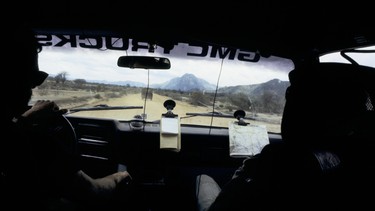 Garry at the wheel of the 1984 GMC Suburban driving through Kenya’s Kaisut Desert, after the truck and drive team had been ambushed by bandits.