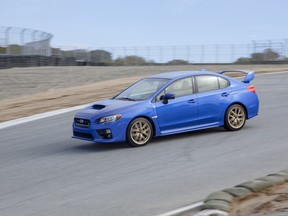 Driving's David Booth finds out if the 2015 Subaru WRX STI can hold its own with a lap around Mazda Raceway Laguna Seca.