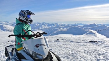 Alexandra takes in the view of mountains in every direction during the guided ride in the Coastal Mountains of B.C.