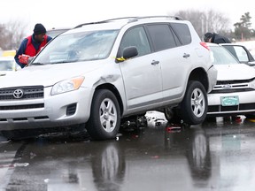 A Salvation Army worker passes out food to drivers whose vehicles were piled up in an accident, Friday, Feb. 14, 2014, in Bensalem, Pa.