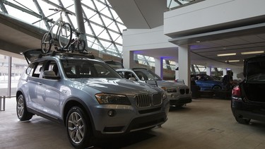 A BMW X3 complete with bicycles to demonstrate its sporty side is seen at the 2014 Ottawa Auto Show at the Ottawa Convention Centre.