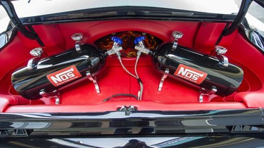 Two NOS tanks inside the trunk of a custom 1967 Mustang Fastback.