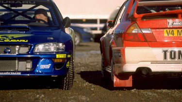 Juha Kankkunen in the Subaru Impreza and Tommi Makkinen in the Mitsubishi Lancer during the Swedish stage of the 2000 FIA World Rally Championship.