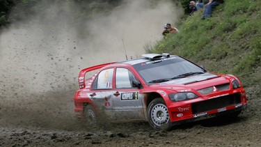 Gilles Panizzi and his co-driver Hreve Panizzi compete with their 2004 Mitsubishi Lancer WRC during the Acropolis Rally of Greece in Pavliani, Greece on  June 4, 2004.