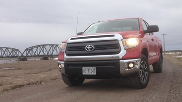 Lisa thinks the 2014 Toyota Tundra in Radiant Red with the SR5 package is a handsome rig — much improved over its predecessors — whose spacious CrewMax cabin features lots of storage, great sightlines and gyrating air vents.