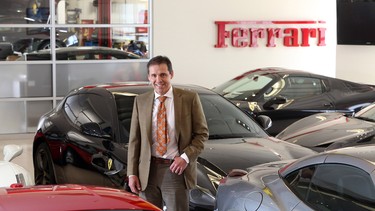 Carlo Galasso, a dealor principle of Ferrari/Maserati of Alberta, stands in his showroom .
