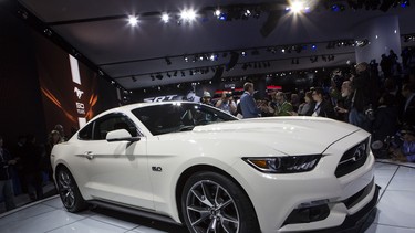 The 2015 50th anniversary Ford Mustang is introduced during a media preview of the New York International Auto Show April 16, 2014 in New York City.