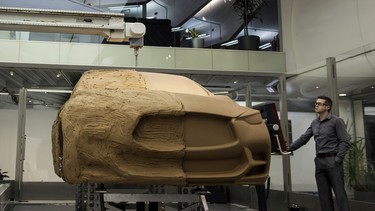 One working tool NDE has is a robotic clay modelling machine that carves out sections of vehicle's exterior.