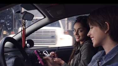 See that pink cell phone? Whatever is on the screen shouldn't be occupying the driver's attention.