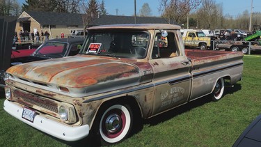 A pick up with the original paint and Patina look and a made to look like a San Quentin truck.