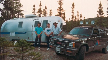 Garry, right, holds court with two residents of Goose Bay, spinning tales of gravel flying, bugs attacking and no fish to hear tell of.