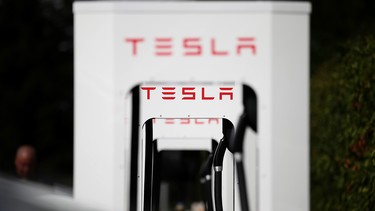 A row of new Tesla Superchargers are seen outside of the Tesla Factory on August 16, 2013 in Fremont, California.