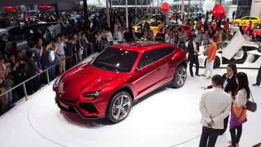 The Lamborghini Urus concept SUV is displayed at the Auto China 2012 car show in Beijing. A new report suggests the Urus will be underpinned by Volkswagen's MLB platform and shared with the Porsche Cayenne.