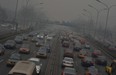 Traffic on the second ring road as heavy air pollution continues to shroud Beijing on February 26, 2014.