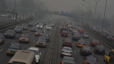 Traffic on the second ring road as heavy air pollution continues to shroud Beijing on February 26, 2014.