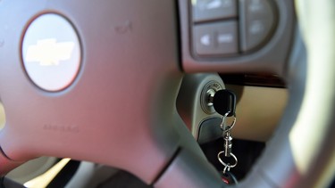 This April 1, 2014 file photo shows a key in the ignition switch of a 2005 Chevrolet Cobalt in Alexandria, Va.