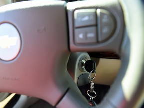 This April 1, 2014 file photo shows a key in the ignition switch of a 2005 Chevrolet Cobalt in Alexandria, Va.