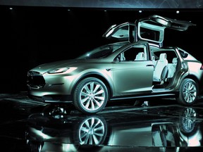 Tesla has announced deliveries of its upcoming Model X crossover have been postponed until 2015.