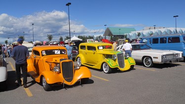 Hot rods under blue skies at Calgary fundraising show.