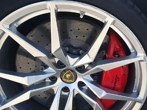 The aftermath of the moment David Booth's $540,000 Lamborghini Aventador tester's wheel met concrete curb. It's not a pretty sight.