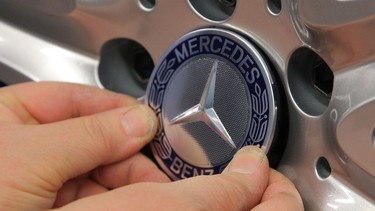 A Daimler AG Mercedes-Benz logo sits on the alloy wheel of a Daimler AG Mercedes-Benz S-Class sedans on the assembly line at the Mercedes-Benz plant of Daimler AG in Sindelfingen, Germany.