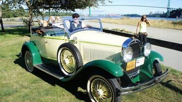 Lawrence Harrop with his three whippet friends and their favourite ride: a 1929 Whippet roadster.