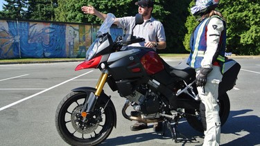 Instructor Noah Nitikman, left, shows Alexandra Straub some tricks on how to work with the centre stand.