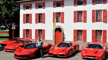 Jon Hunt stands with his collection of exclusive Ferraris, along with his newly purchased LaFerrari super-hybrid.