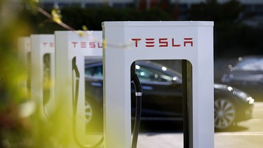 A row of new Tesla superchargers are seen outside of the Tesla Factory on August 16, 2013 in Fremont, California.