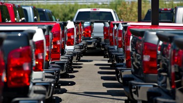 Chevy Silverado pickup trucks sit on display at a General Motors Co. dealership in Peoria, Illinois, U.S., on Wednesday, Aug. 1, 2012.