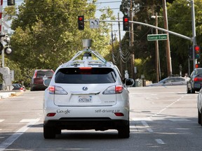 Google's driverless car navigates along a street in Mountain View, Calif.
