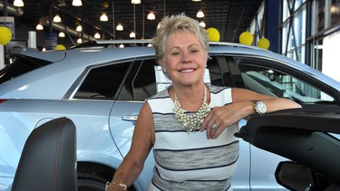 Pam Keith poses in the showroom of Dueck Auto Group in Vancouver. Keith has chaired the board of the Special Olympics committee for three years.