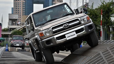 Customers test-drive Japan's auto giant Toyota Motor's 30th anniversary model of "Land Cruiser 70".