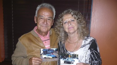 Bob and Irene Kokotailo pose with photos of their drag race cars.